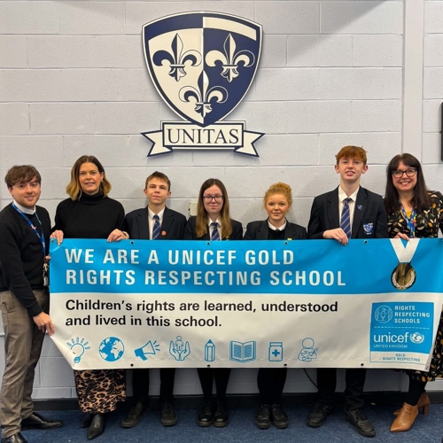 Group of pupils with banner